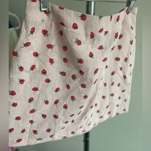 NWOT Francesca’s strawberry gingham skirt. Slightly sheer but SUPER cute!